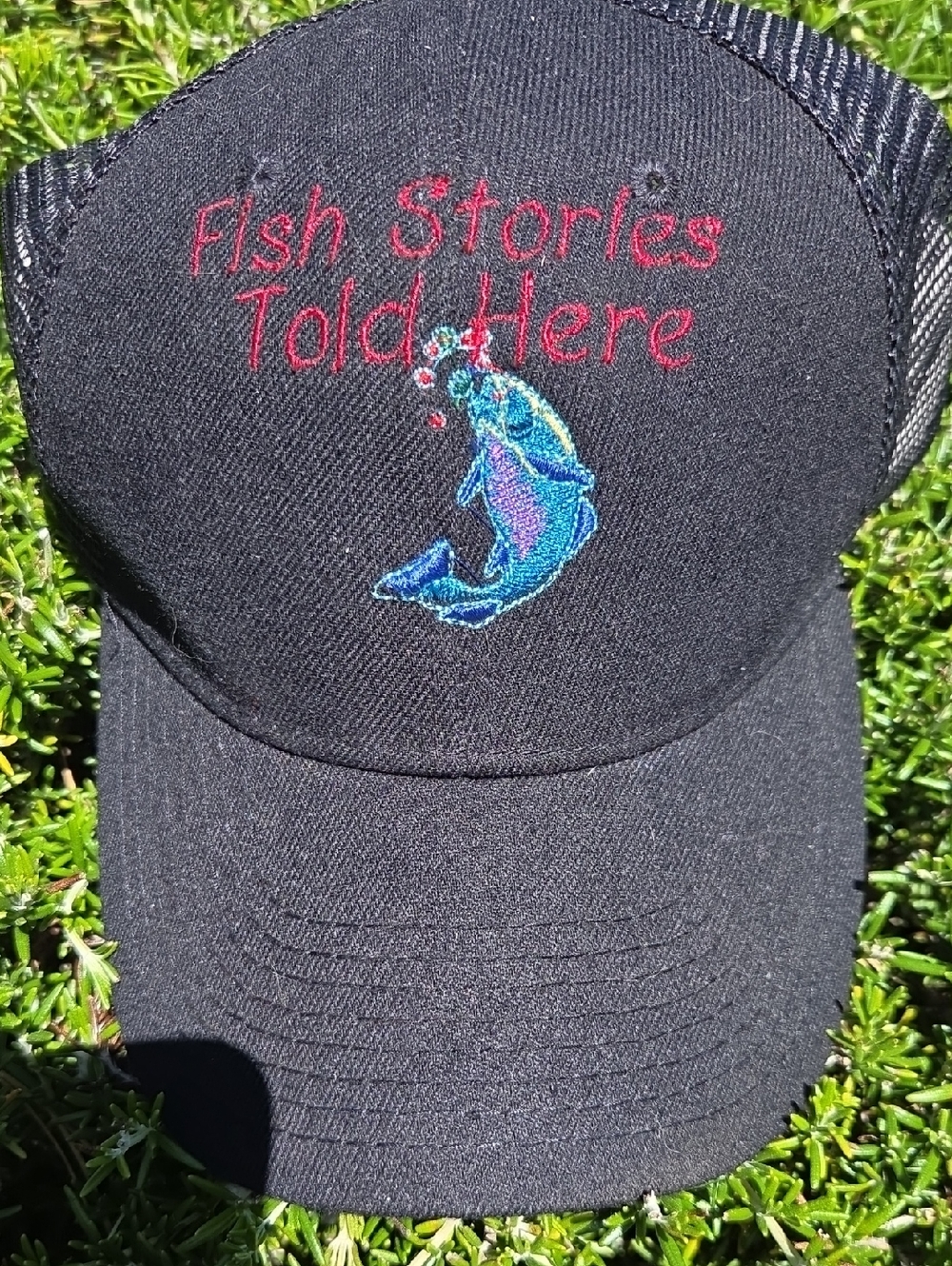 Fish Stories Told Here Embroidered Black Trucker Cap